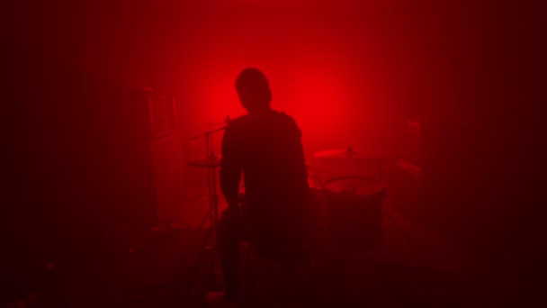 Silhouette Of A Drummer In A Dark Foggy Red Room Tune The Drum Set Low Key