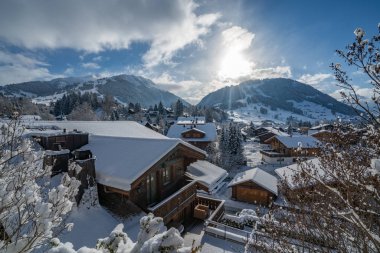 Gstaad village covered by snow clipart