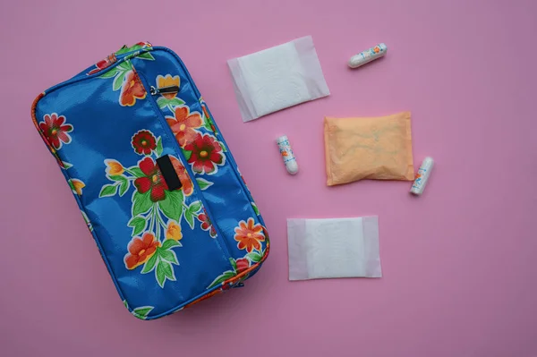 Cosmetic bag with cosmetic pads and tampons