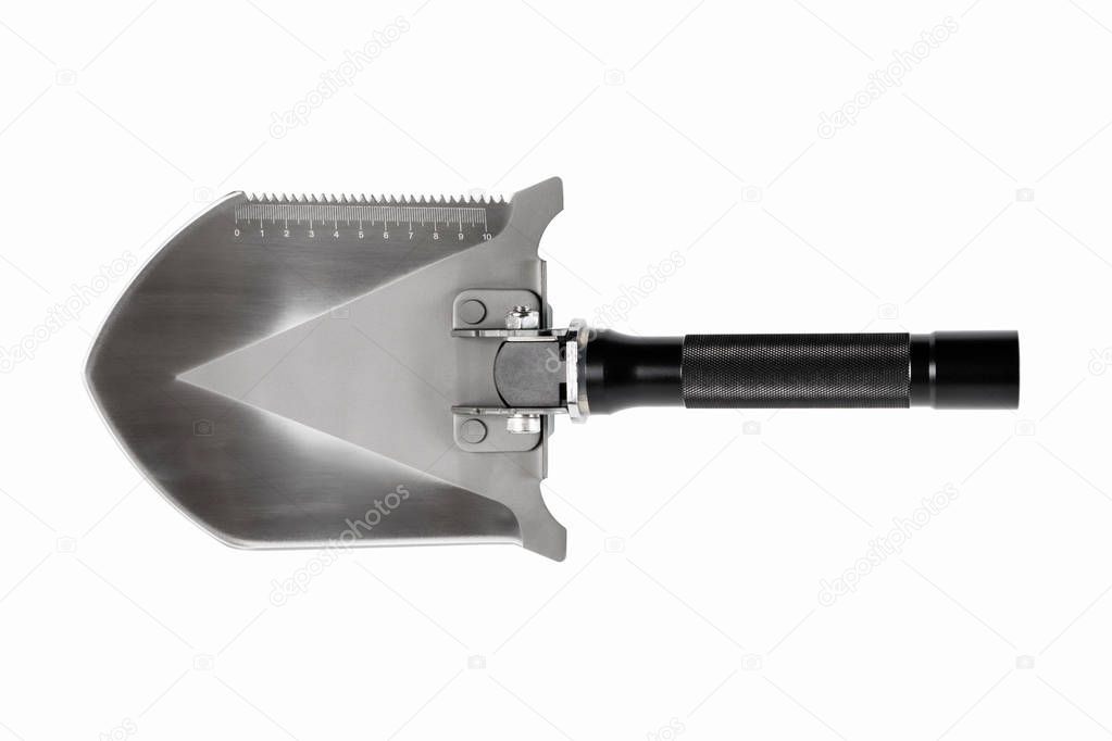 Sharp metal shovel with a saw on white background. Isolated.