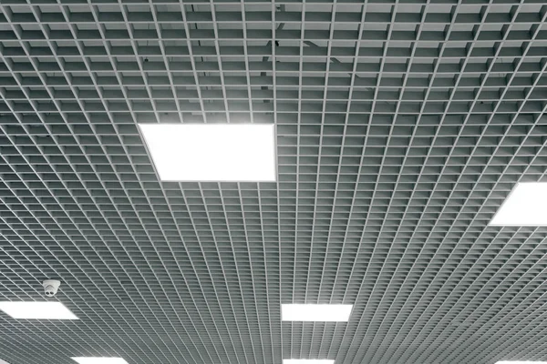 Grid structure of suspended ceiling. Contemporary interior design.