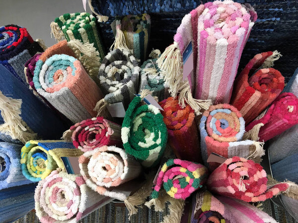 Recycled rug background. Colorful cloth materials. Handmade. Colorful handmade rugs piled up on display at central market. Traditional handmade colorful rug
