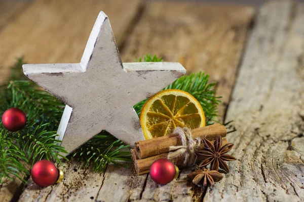 White wooden Christmas star with decorations