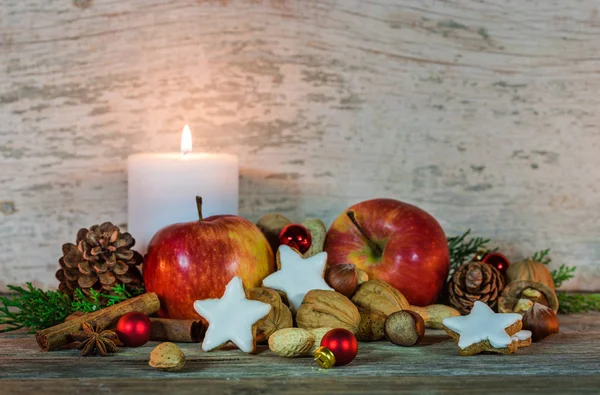 Christmas time, food and candle decoration with wood background, copy space