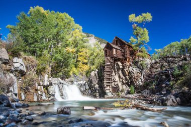 Abandon Crystal Mill in Colorado mountain in falls clipart
