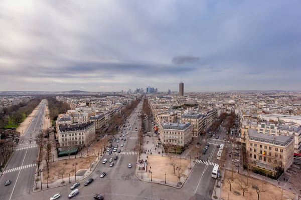 View of Champ Elysee Ave and Paris city skyline from the top Arc de Triomphe, France.