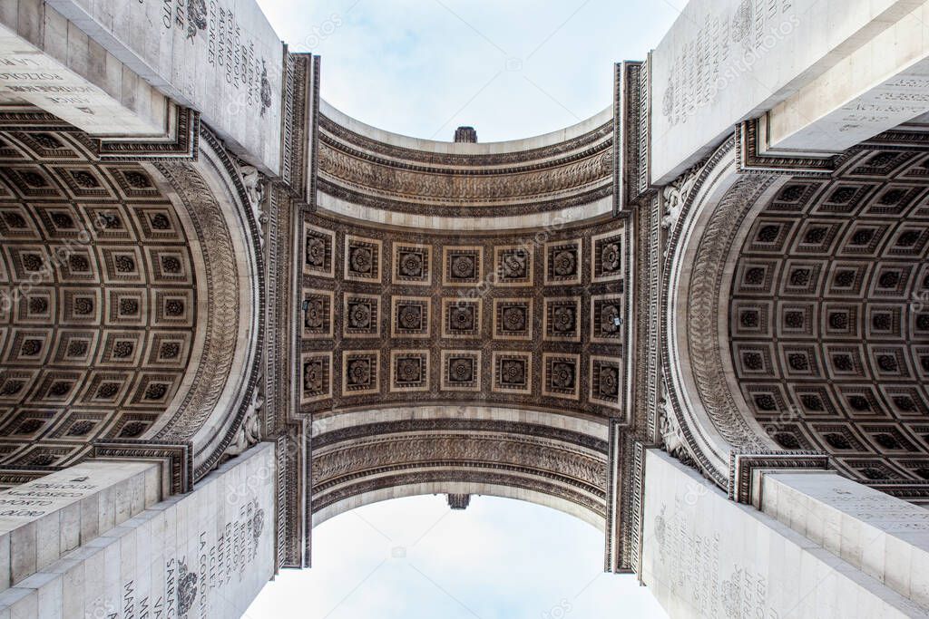 Detail architecture of Arc de Triomphe monument in Paris, France.