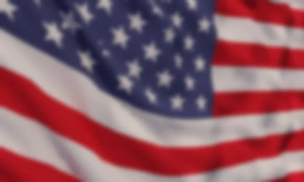 Background with a blurred waving American flag.Vector template for USA patriotic holidays.