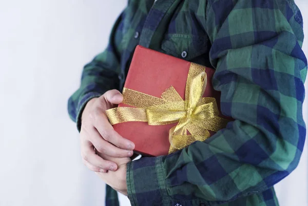 Young Handsome Guy Holds Gift His Hands Close — Stock Photo, Image