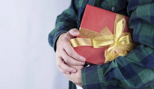 Young Handsome Guy Holds Gift His Hands Close — Stock Photo, Image