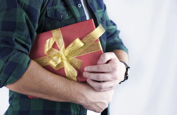Young Handsome Guy Holds Gift His Hands Close — Stock Photo, Image