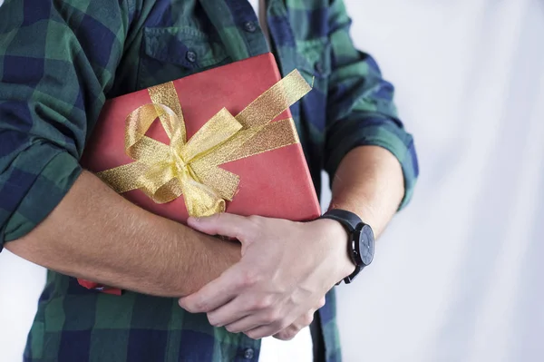 Young Handsome Guy Holds Gift His Hands Close — Stock Photo, Image