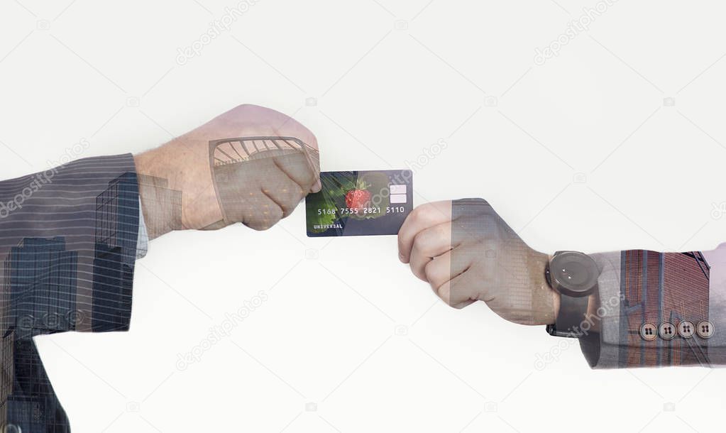 hands of men transferring a credit card or business card on an isolated background