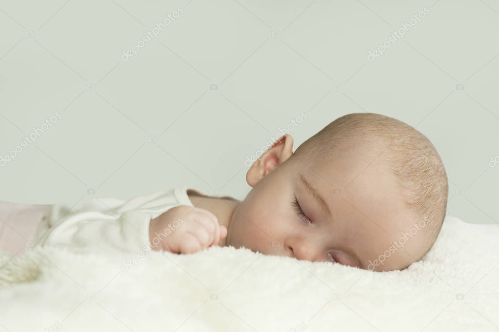 close-up portrait of a beautiful sleeping baby on the bed. healthy sleep concept