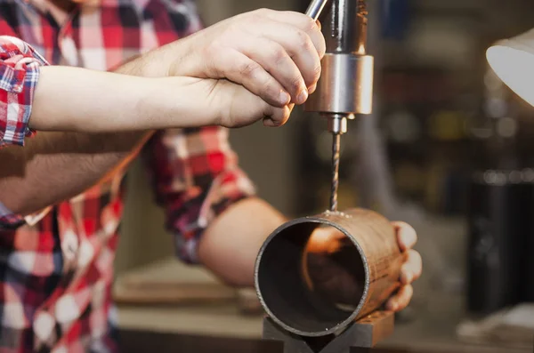 father took his little son to work with metal. Concept of relationship, child at work turner