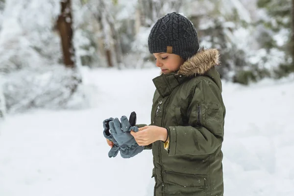 Cute Little Boy Putting Winter Glows Outdoor — Stock Photo, Image