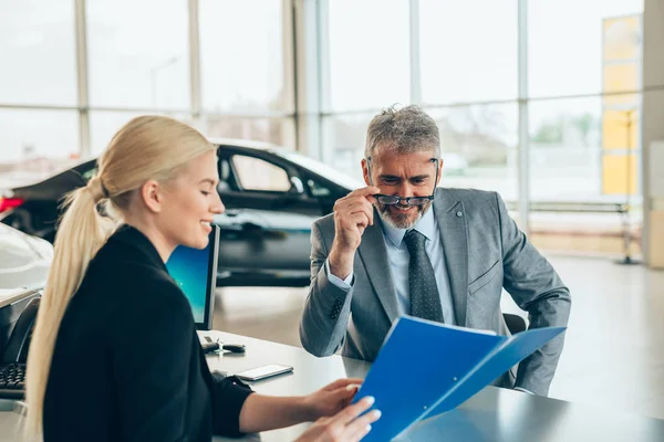 Saleswoman Showing Brochure Customer Car Dealership Showroom — Stock Photo, Image