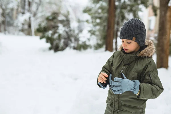 Cute Little Boy Putting Winter Glows Outdoor — Stock Photo, Image