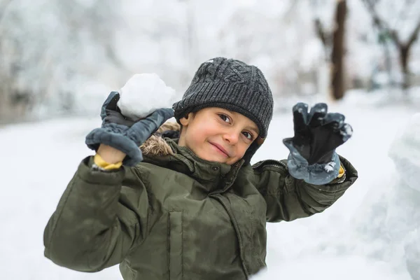 Boy Making Snowball Outdoor — Stock Photo, Image