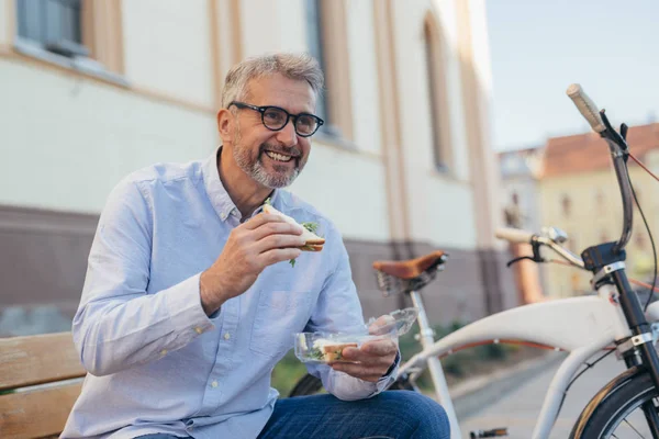 Mature Man Eating Sandwiches Outdoor City — Stock Photo, Image