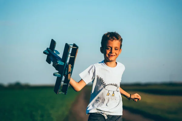 Preteen Boy Running Outdoor Meadow Playing Wooden Toy — Stock Photo, Image