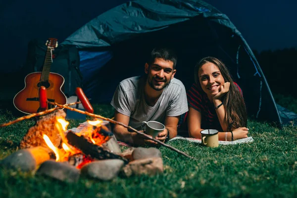 romantic couple on night camping outdoor