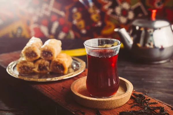 Turkish tea and baklava on wooden table