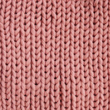 Arka plan için pembe örme doku. Merinos ipliği. Yaşayan mercan rengi