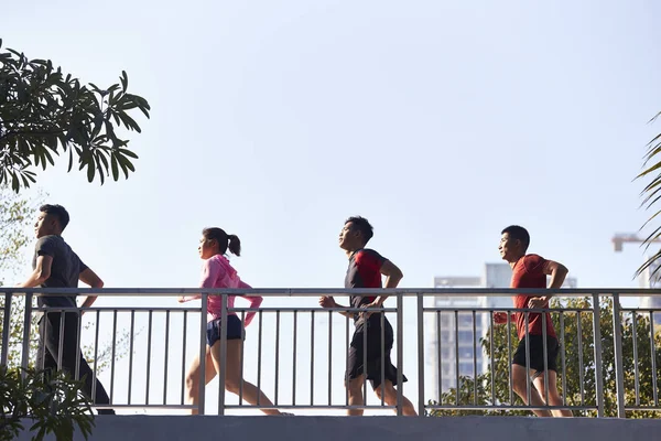 Four Young Asian Runner Running Morning Passing Footbridge — Stock Photo, Image