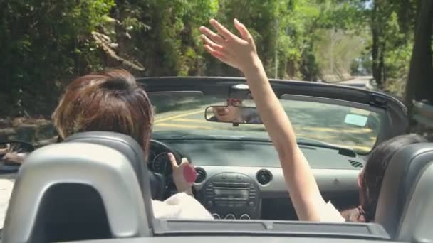Young Asian Couple Having Fun Driving Riding Convertible Sport Car — Stock Video