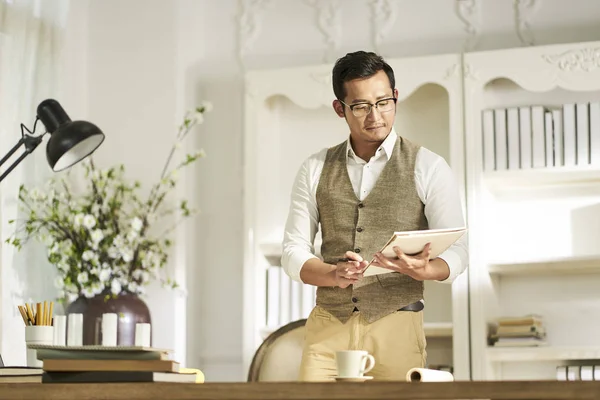 Young asian designer working at home — Stock Photo, Image