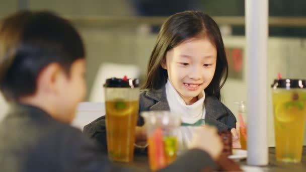 Two Little Asian Children Eating Dessert Coffee Shop — Stock Video