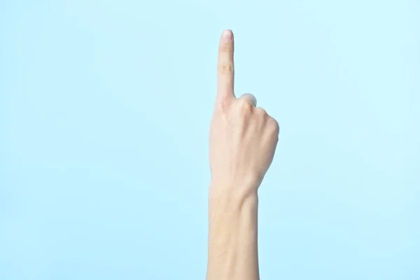 Ανθρώπινο χέρι που δείχνει το νούμερο ένα — Φωτογραφία Αρχείου