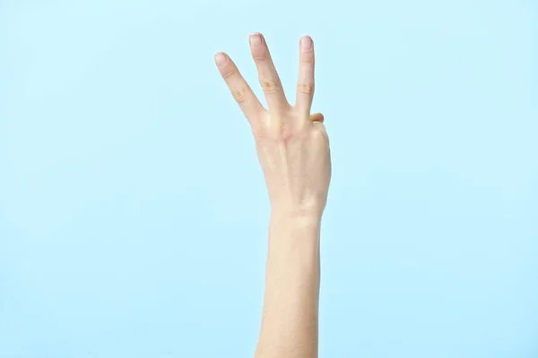 Mão humana mostrando número três — Fotografia de Stock