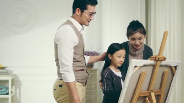 Nine Year Old Little Girl Making Painting Two Parents Standing — Stock Video