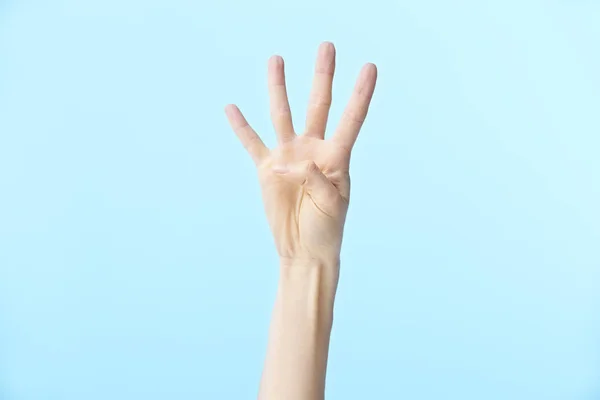 Ludzka ręka pokazująca numer cztery — Zdjęcie stockowe