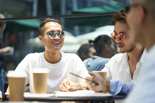 young asian people relaxing in coffee shop