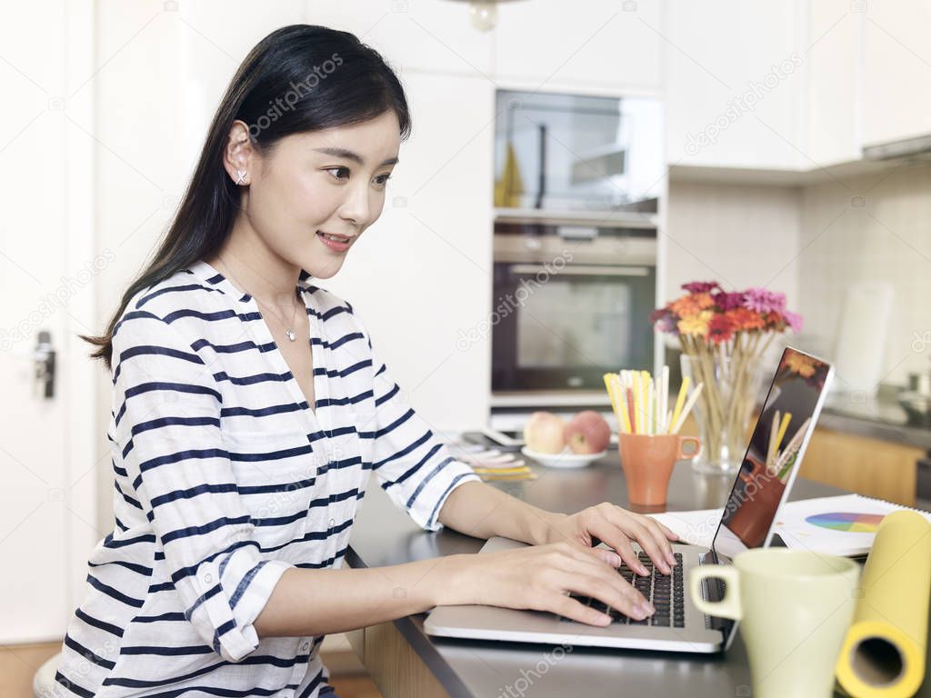 young asian woman working from home