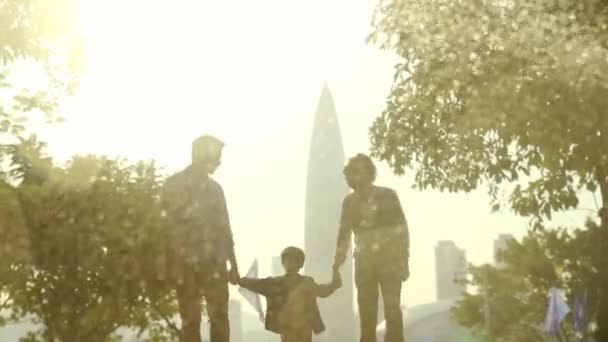 Young Asian Parents Having Fun Child Outdoors City Park — Stock Video