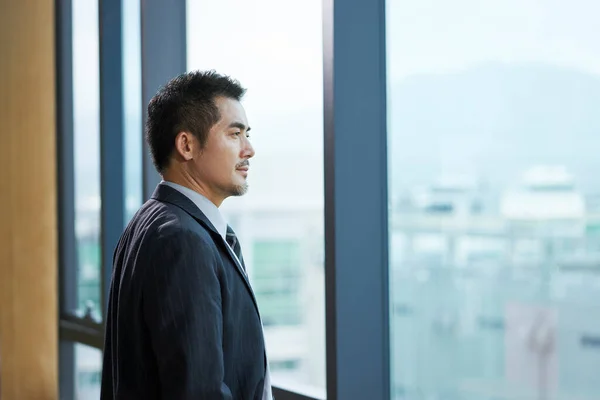 Asian Corporate Executive Standing Window Looking Out — Stock Photo, Image
