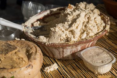 Traditional Sardinian cheese with worms. Banned and illegal cheese with flies and worms inside. clipart