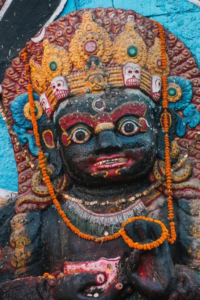 statue of a Buddhist Deity called Mahakala, located in Durbar Square in Kathmandu, Nepal