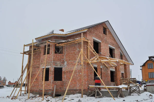 private brick house under construction