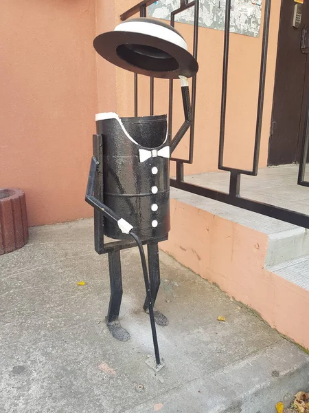 Trash can in the form of a man in a tuxedo