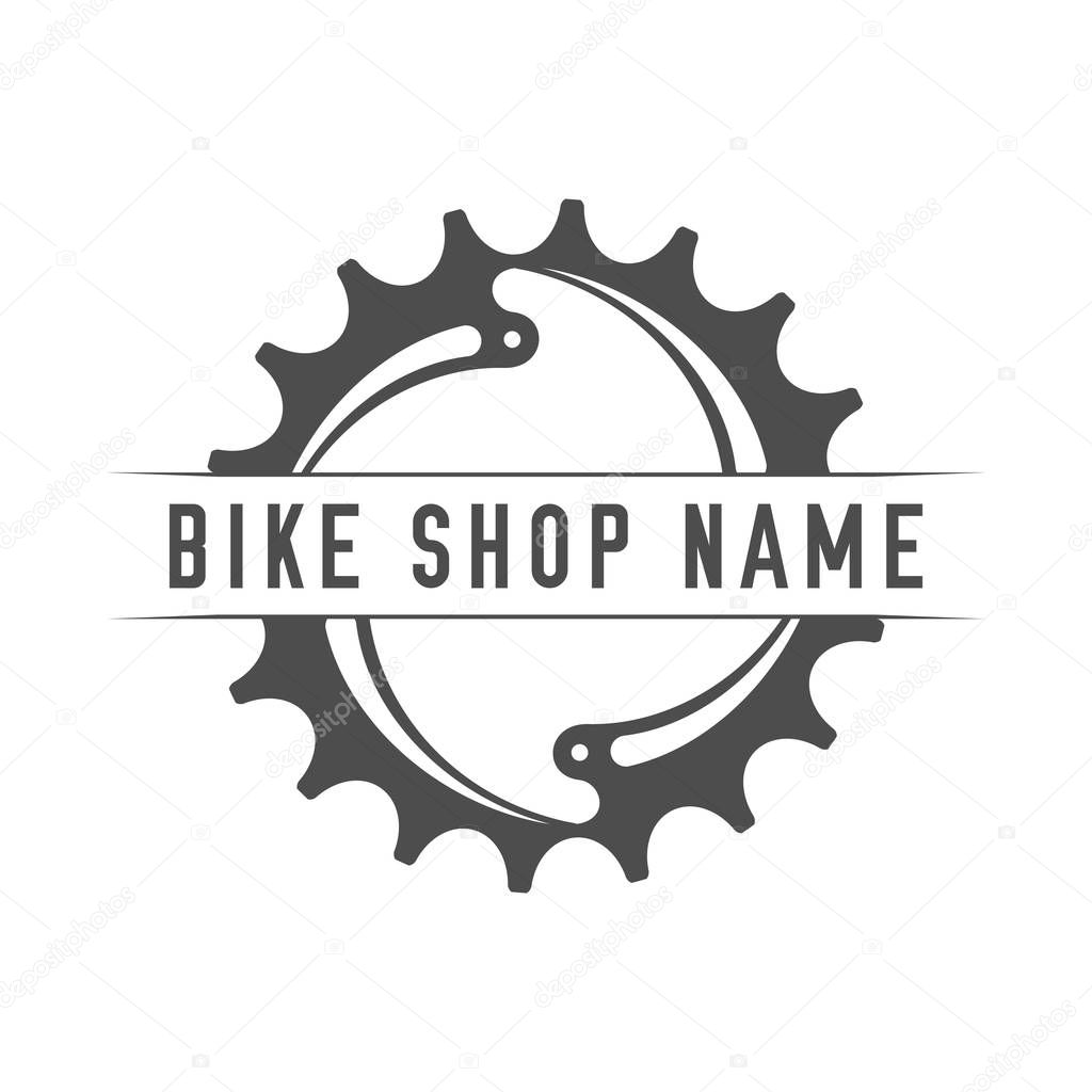Bikes Shop Emblem. Design Element for Bike Shop or Advertising Banner. Chainring and Place for Your Bike Shop Name, Monochrome Vector Illustration.