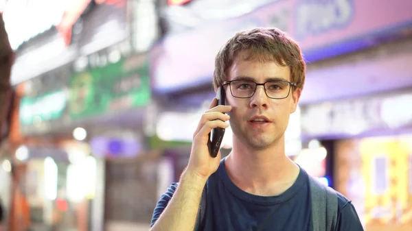 Young Man Calling On Mobile Phone at Night