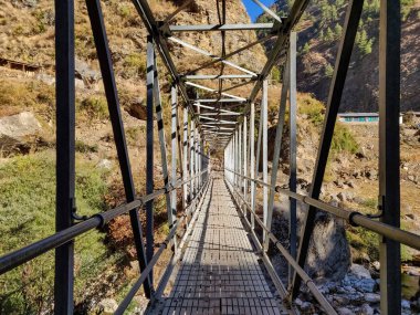 Suspension bridge connecting two villages in remote part of Nepal