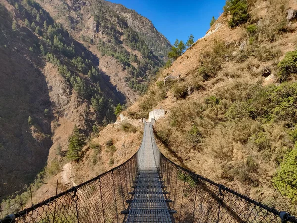 Suspension bridge connecting two villages in remote part of Nepal