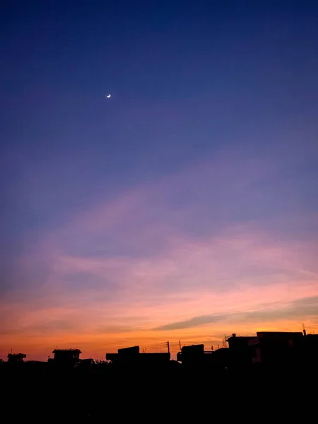 Twilight and the moon in the flatland of Nepal