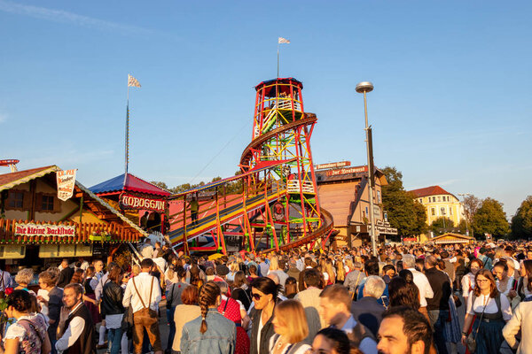 Munich, Germany - 2018  September 28: locals and tourist watching the Toboggan at the biggest folk festival in the world - the oktoberfest